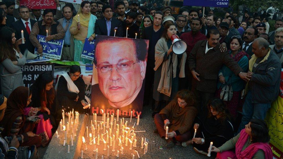 Pakistani civil society activists light candles on the 5th anniversary of the death of the killing of politician Salman Taseer