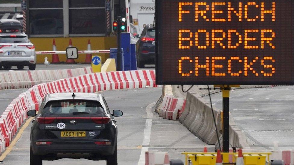 Car approaches border checks in Dover. Next to sign that readers "French Border checks"