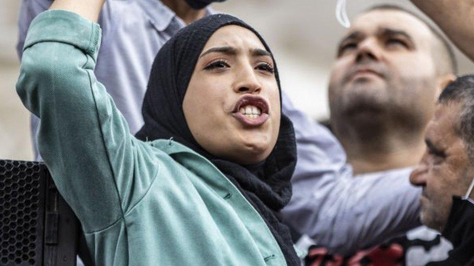 Demonstrators gather at Avenue Habib Bourguiba to protest against Tunisian President Kais Saiedâs "extraordinary decisionsâ amid a heavy security presence in Tunis, Tunisia on October 10, 2021