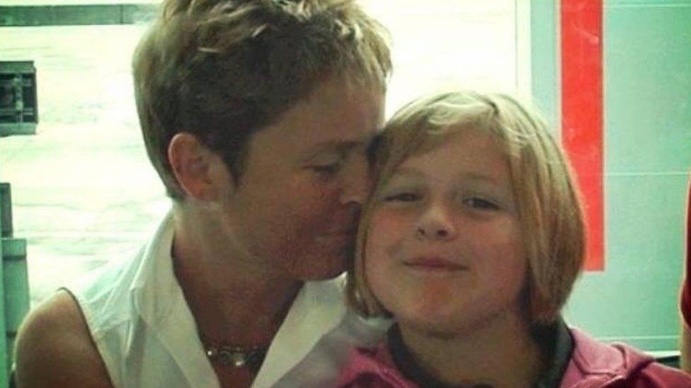 Phoebe aged 9 getting a kiss from her mum