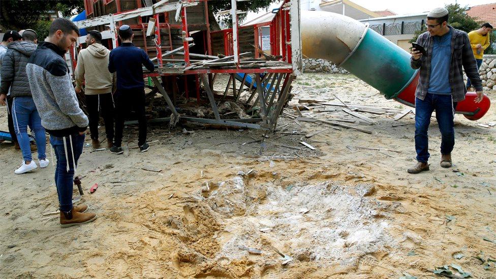 Israelis inspect a playground in Sderot hit by a Palestinian Islamic Jihad rocket fired from Gaza (24 February 2020)