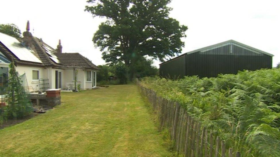 Barn next to house in West Wellow