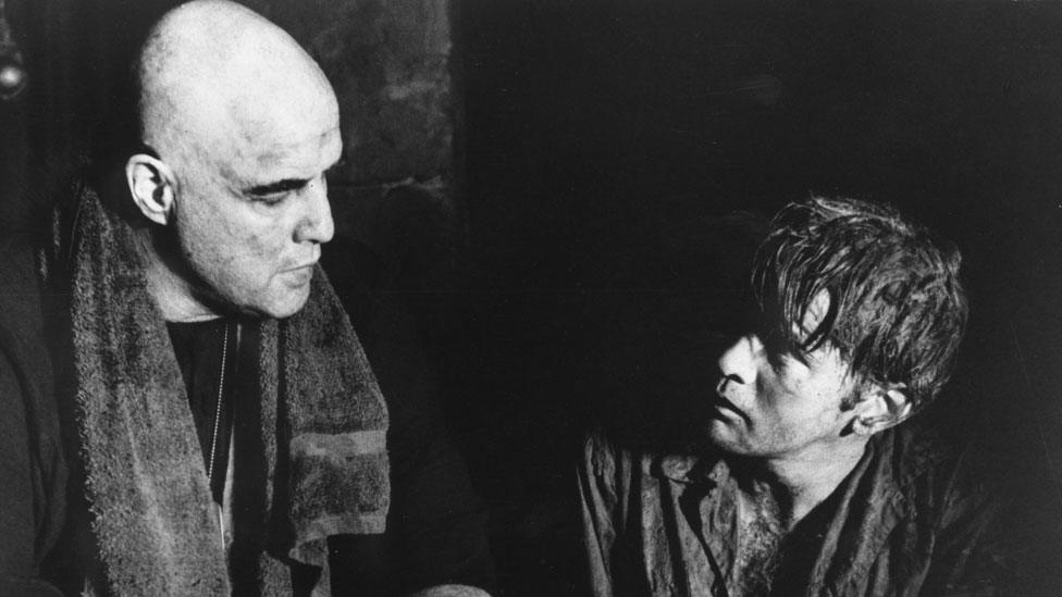 Marlon Brando (L) as Colonel Kurtz and Martin Sheen as Captain Willard in Francis Ford Coppola's Vietnam film Apocalypse Now