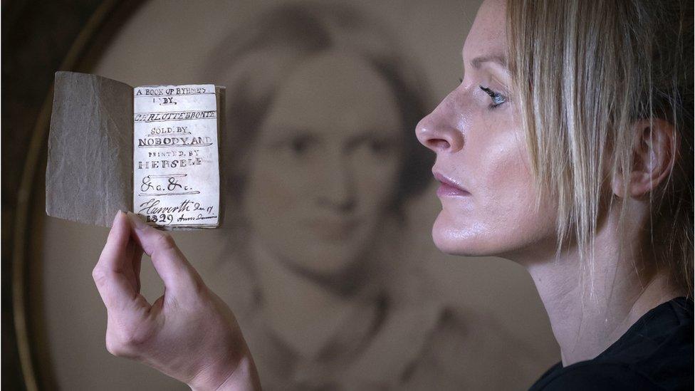 Sarah Laycock, curator at Parsonage Museum with the book