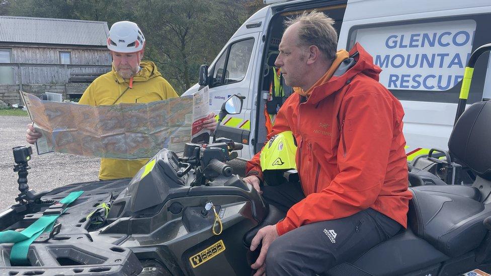 Glencoe team looking at maps