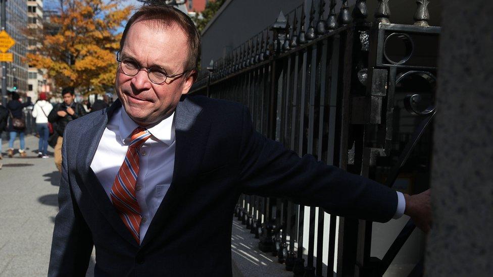 White House Budget Director Mick Mulvaney, President Donald Trump's pick for acting director of the Consumer Financial Protection Bureau, walks back to the White House from the CFPB building