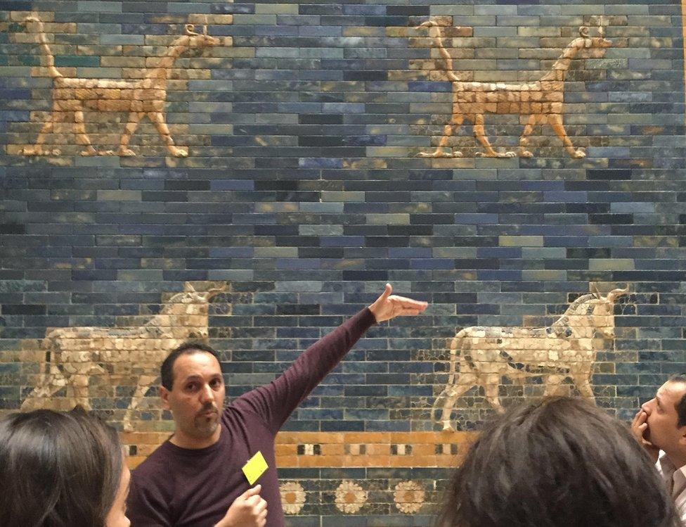 Bashar with Ishtar gate of Pergamon behind him