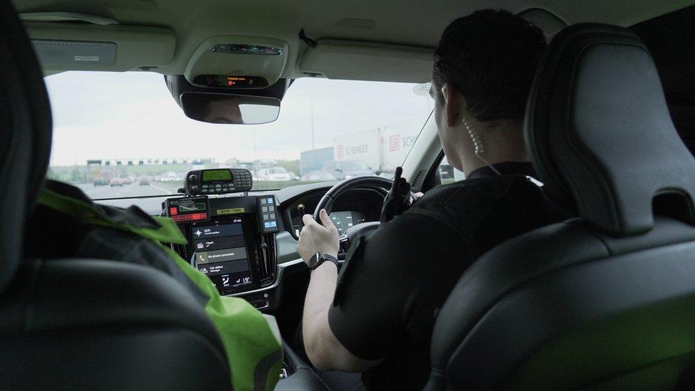 Police officers in a police car