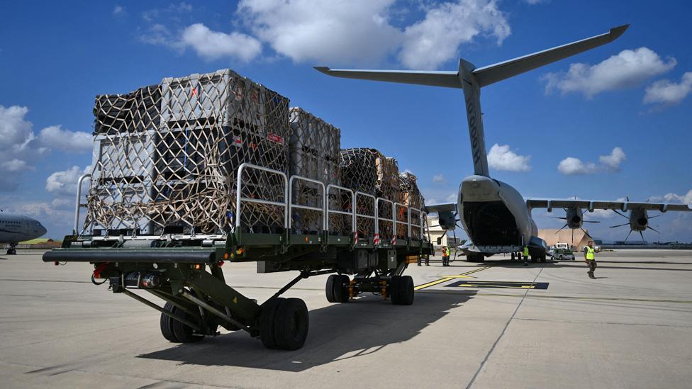 French servicemen and emergency personnel load cargo onto a French Air Force Airbus A400M-180 aircraft as France prepares to send assistance to Libya - 13 September 2023