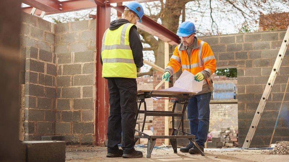 Builders at a home