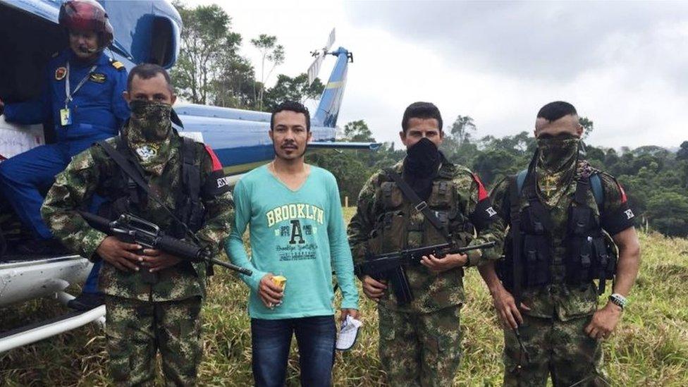 Handout picture released by Cali's' Archbishopric showing Colombian Army corporal Jair de Jesus Villar Ortiz escorted by ELN guerrillas in a rural area between the departments of Antioquia and Bolivar, Colombia on March 20, 2016.