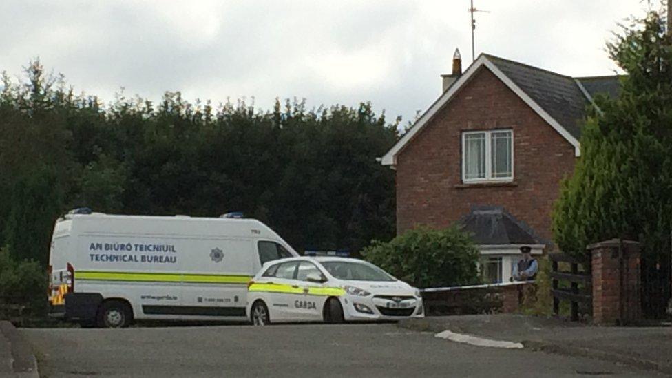 Officers outside the family home in 2016