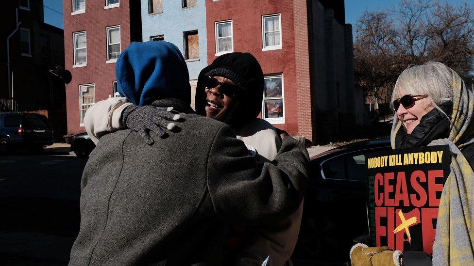 Activists and residents embrace