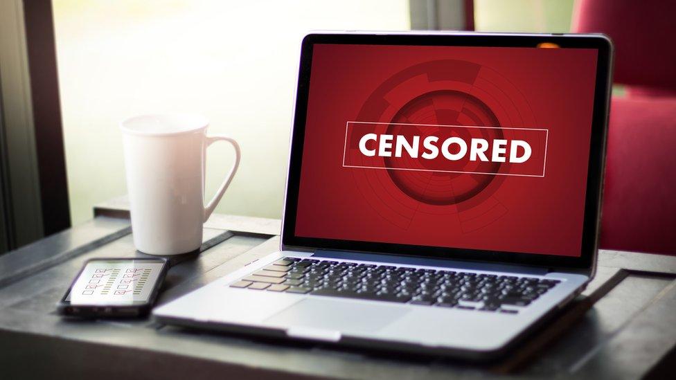 Censored logo on laptop screen