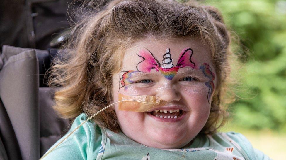 Ellie in face paint enjoying face the Julia's House Family Garden Party