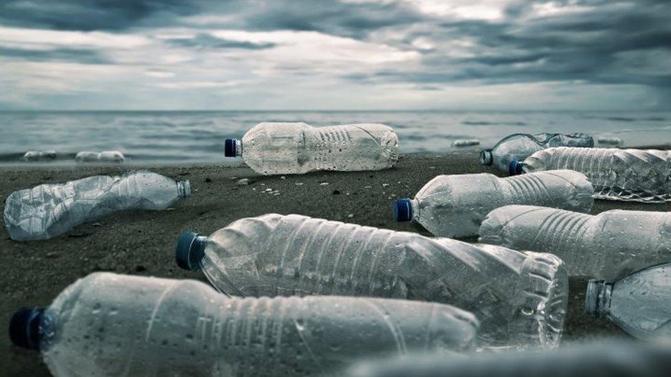 Plastic-bottles-shown-on-sand.