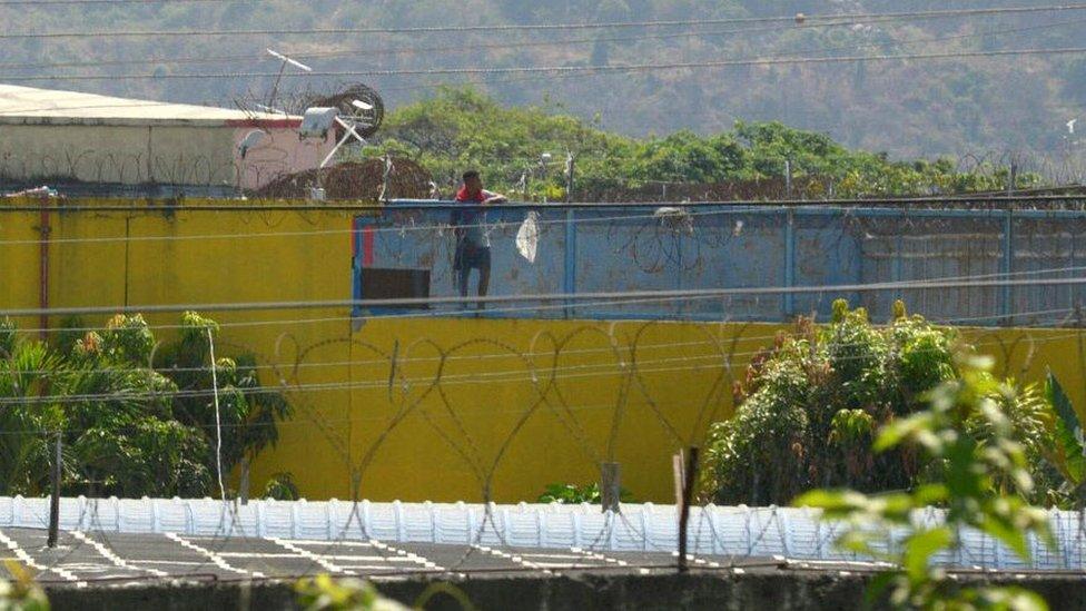 An inmate is seen at a prison in Guayaquil, Ecuador, on September 29, 2021, after a riot occurred.