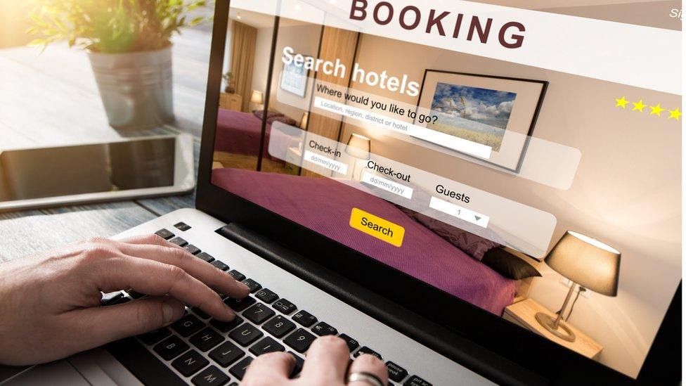 A man booking a holiday online