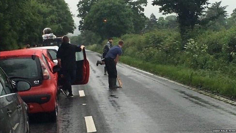 People playing cricket while in the queues for Glastonbury