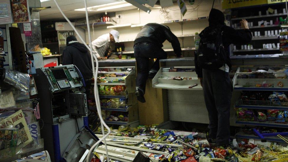 Looters rampage through a convenience store in Hackney, east London August 8, 2011