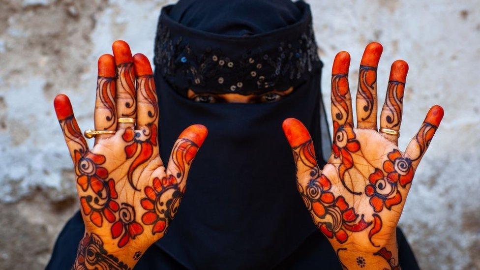 Muslim woman with henna on the hands and arms, Lamu County, Lamu, Kenya on March 2, 2011 in Lamu, Kenya.