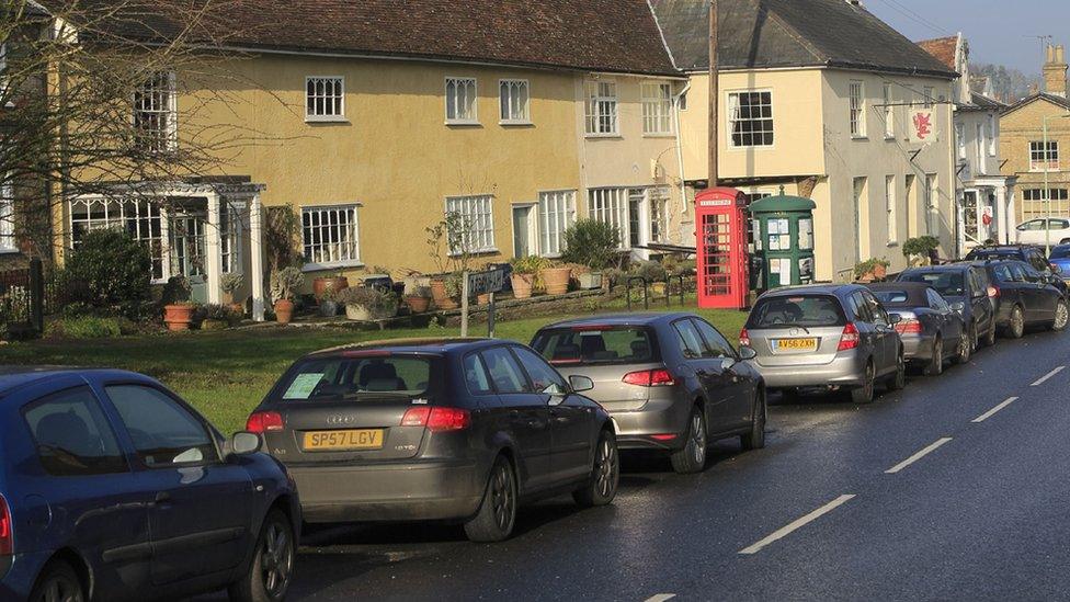 Cars parked outside houses