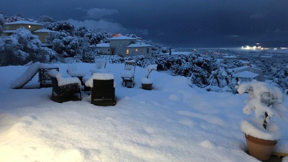 A house garden covered with snow near Ajaccio on the French Mediterranean island of Corsica