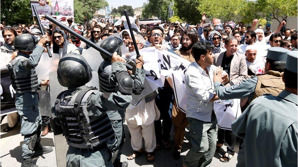 Afghan policemen clash with demonstrators during a protest in Kabul, Afghanistan 2 June 2017