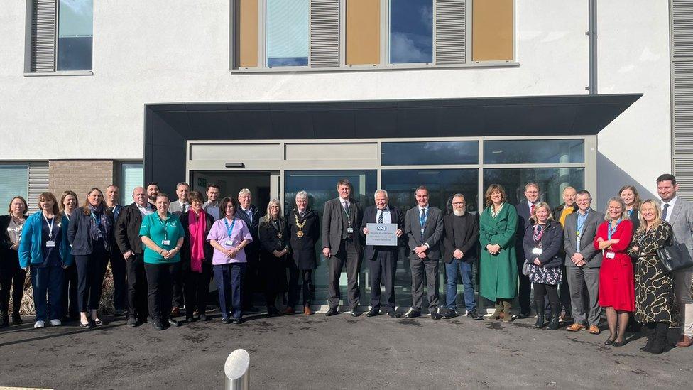 A group of people outside a health centre