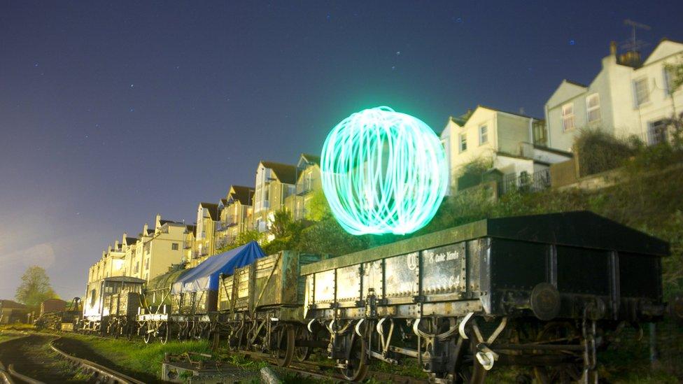 Orb of light above a railway truck