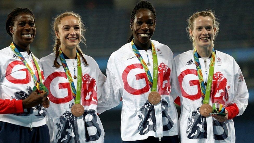 Eilidh Doyle (right) celebrates her medal with the GB women's 4x400m quartet