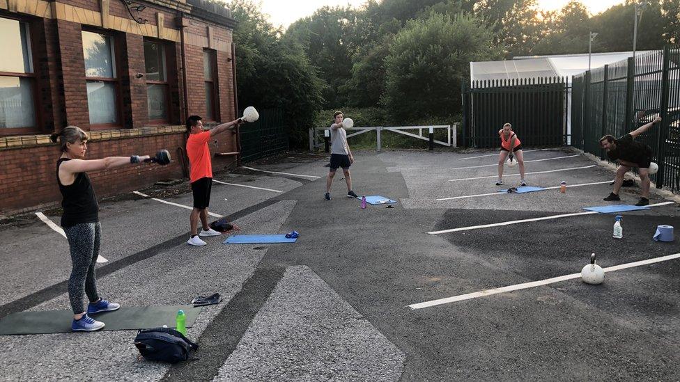 Outdoor gym class in the car park of Seven Movement gym