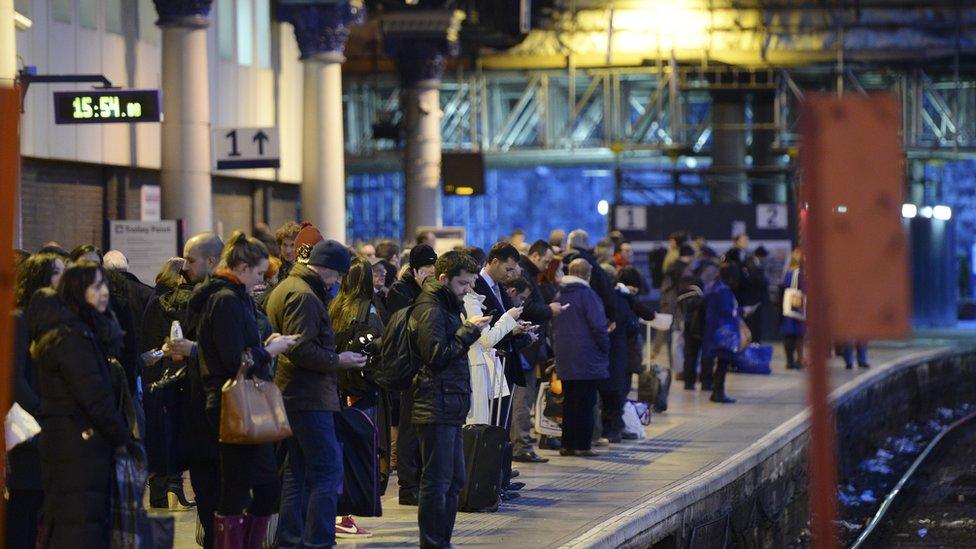 Passengers at Glasgow Queen Street station