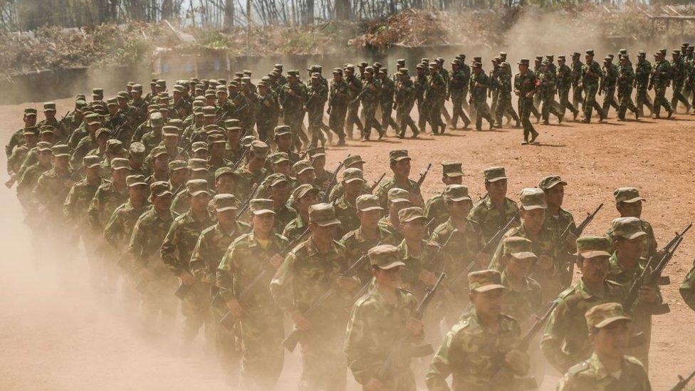 Members of ethnic rebel group Ta'ang National Liberation Army (TNLA) take part in a training exercise at their base camp in the forest in Myanmar's northern Shan State