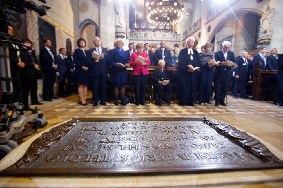 German Chancellor Angela Merkel, German President Steinmeier and President of Germany's lower house of parliament Bundestag Schaeuble attend the 500th anniversary of the Reformation in front of the grave of Martin Luther at the Castle Church in Wittenberg, Germany, 31 October 2017