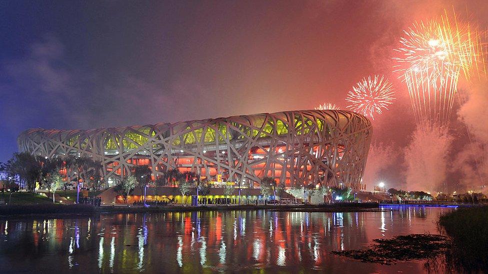 Fireworks explode over the National Stadium, also known as the "Bird's Nest",