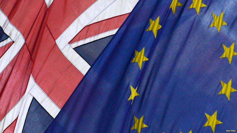 British Union flag and European Union flag are seen hanging outside Europe House in central London June 9, 2015.