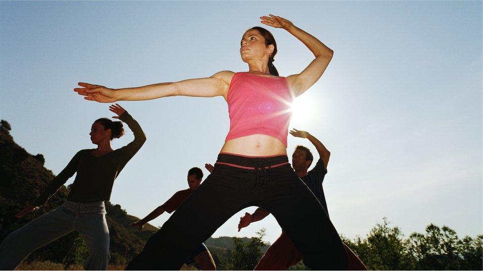 An outdoors tai chi group