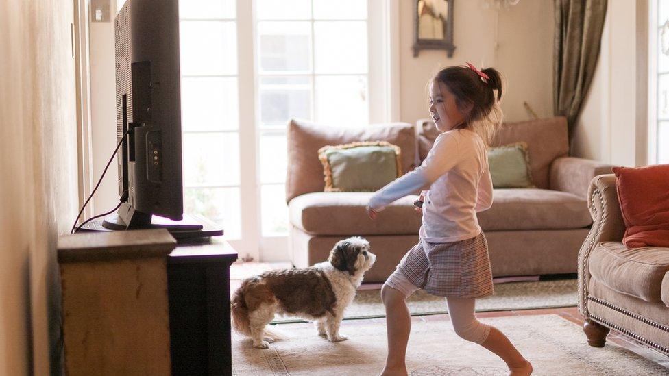 Child-dancing-in-front-of-TV.