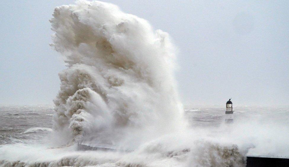 Huge waves crash against the lighthouse in Seaham Harbour