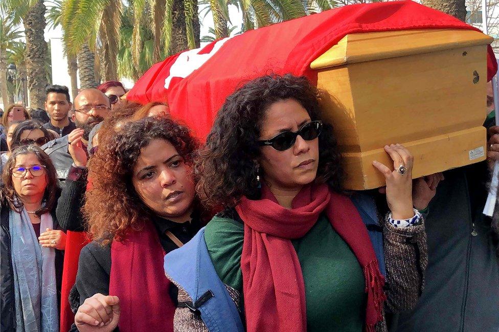 Tunisian women carry the coffin of human rights defender, internet-activist and blogger Lina Ben Mhenni during her funeral procession on January 28, 2020