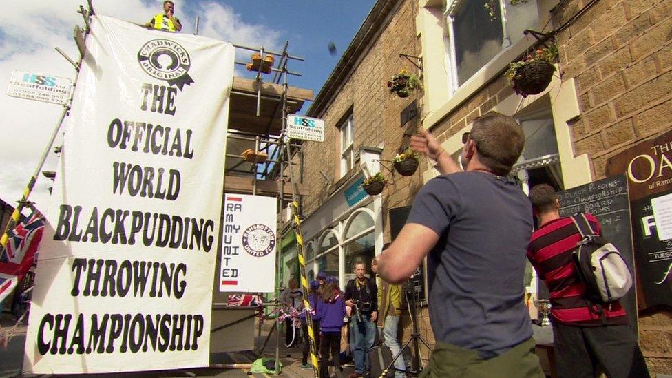 Contestants lobbed the black puddings at a stack of Yorkshire puddings placed on a platform