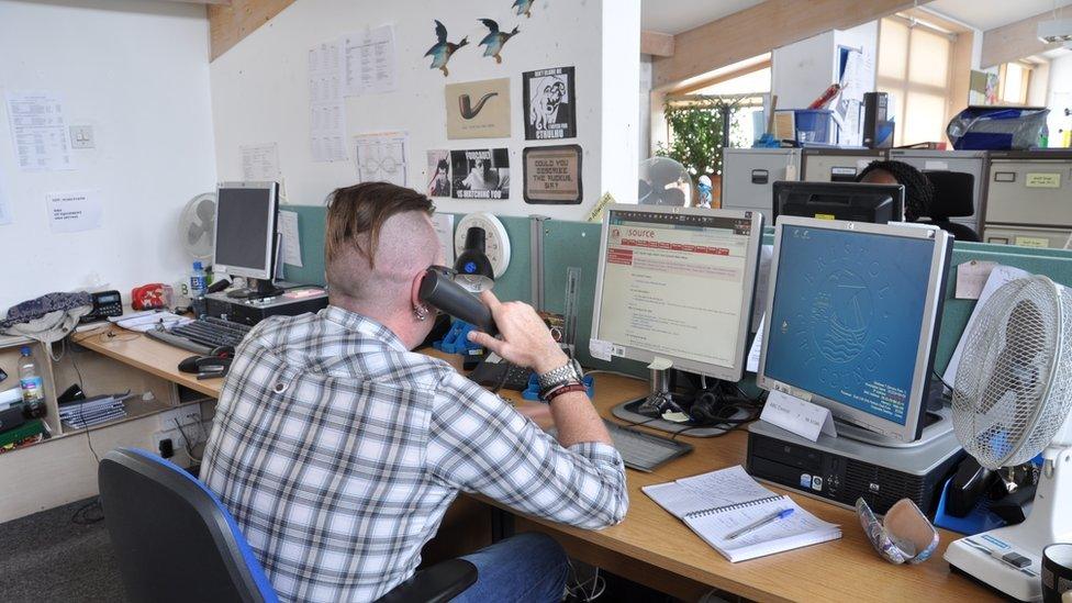 Social worker at desk