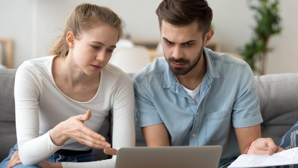 Tenants look at computer