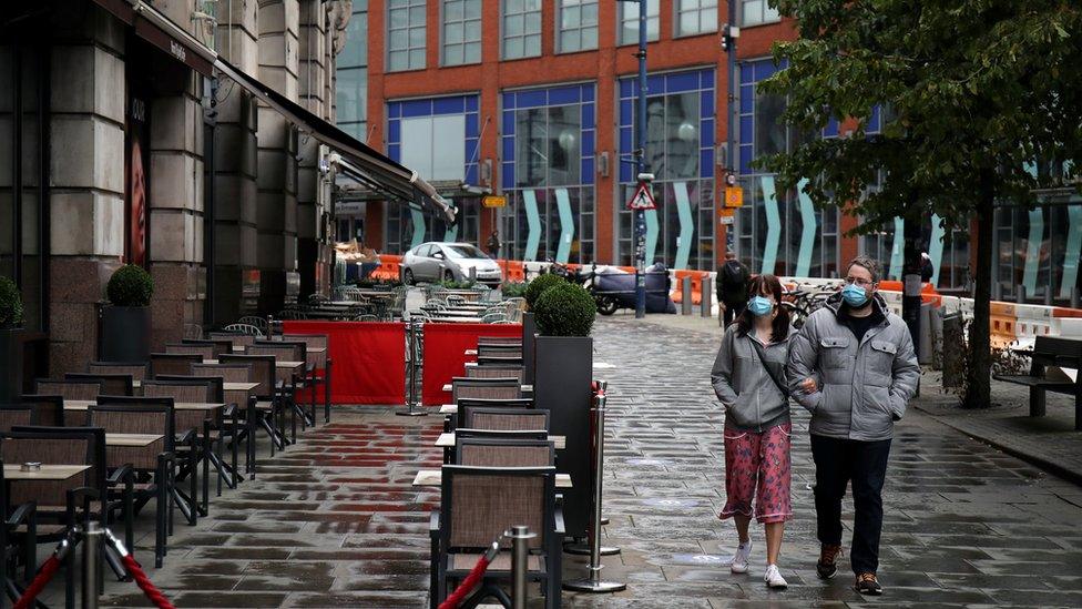 Couple with face masks in Manchester