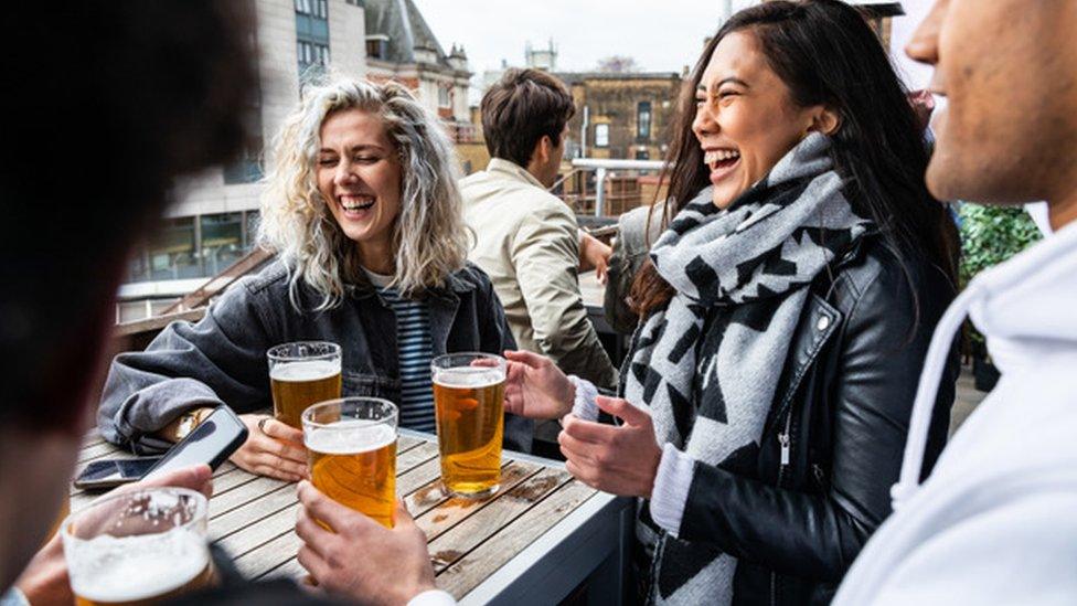 People drinking in a pub