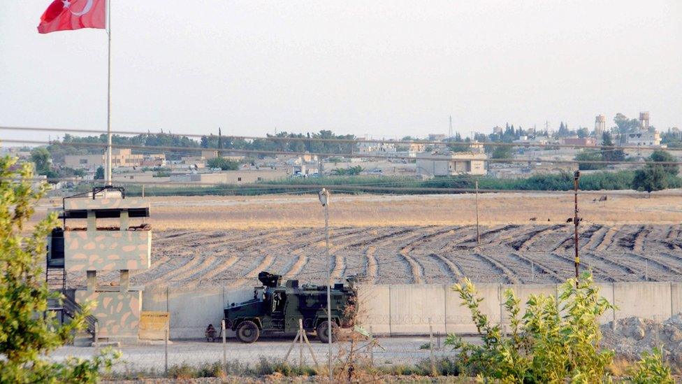 Turkish troops patrol near the border with Syria, in Akcakale, in Sanliurfa, south-eastern Turkey (14 August 2019)