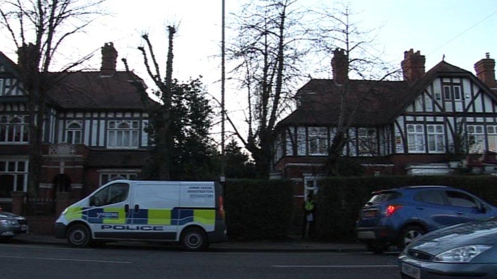 A police van outside the house where the baby's body was found