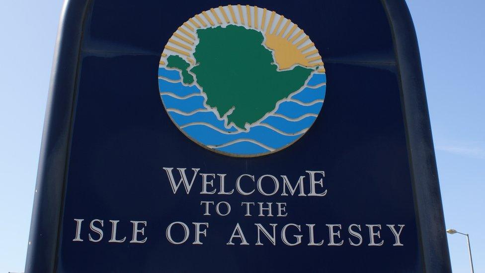 Sign 'Welcome to Isle of Anglesey' at Holyhead port