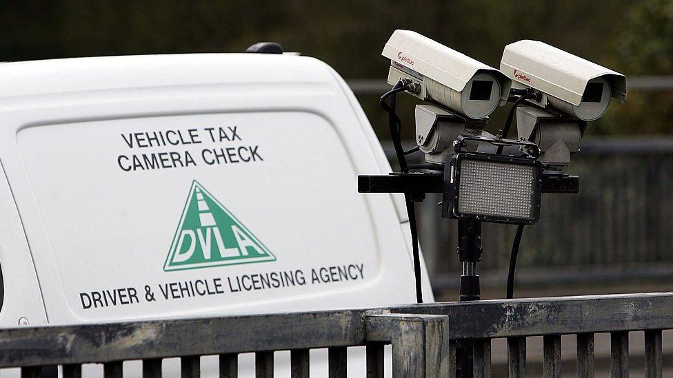 A number plate recognition camera, operated by the UK's Driver and Vehicle Licensing Agency, scans the M77 motorway for vehicles